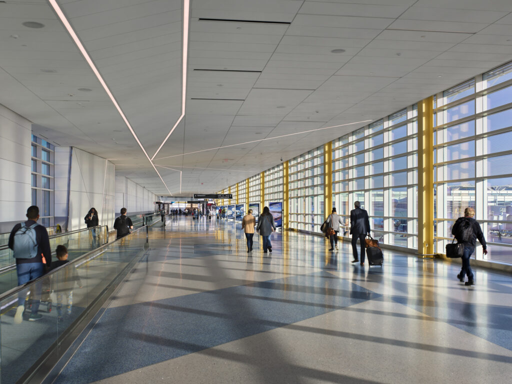 people walking through terminal