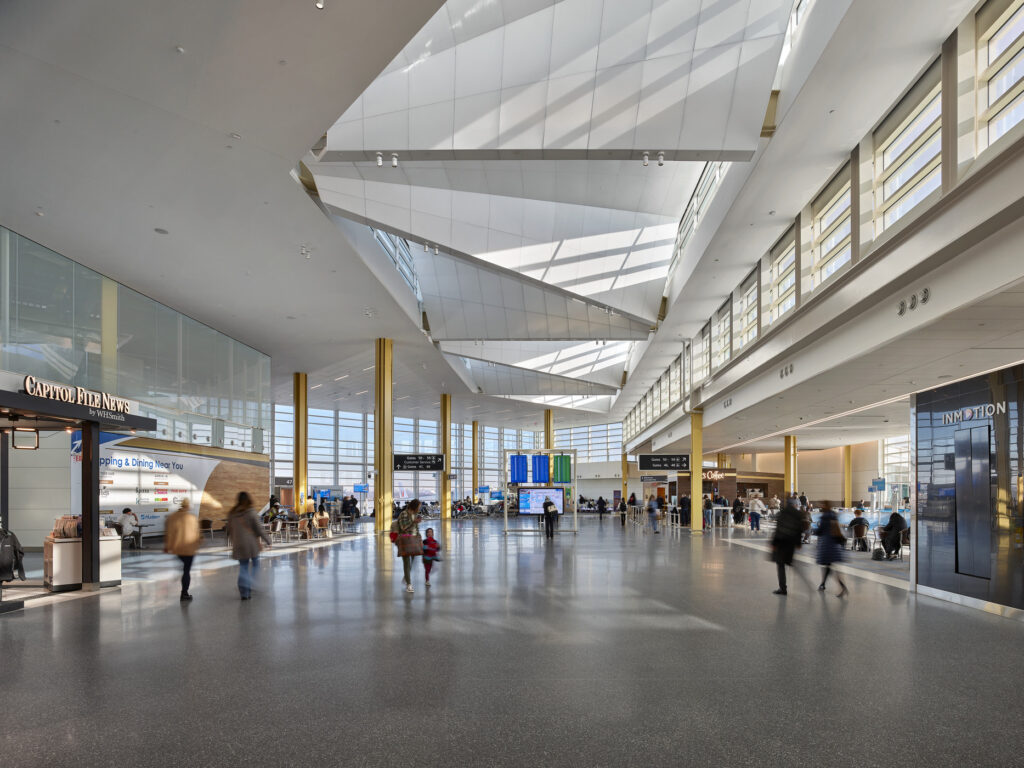 people walking through terminal