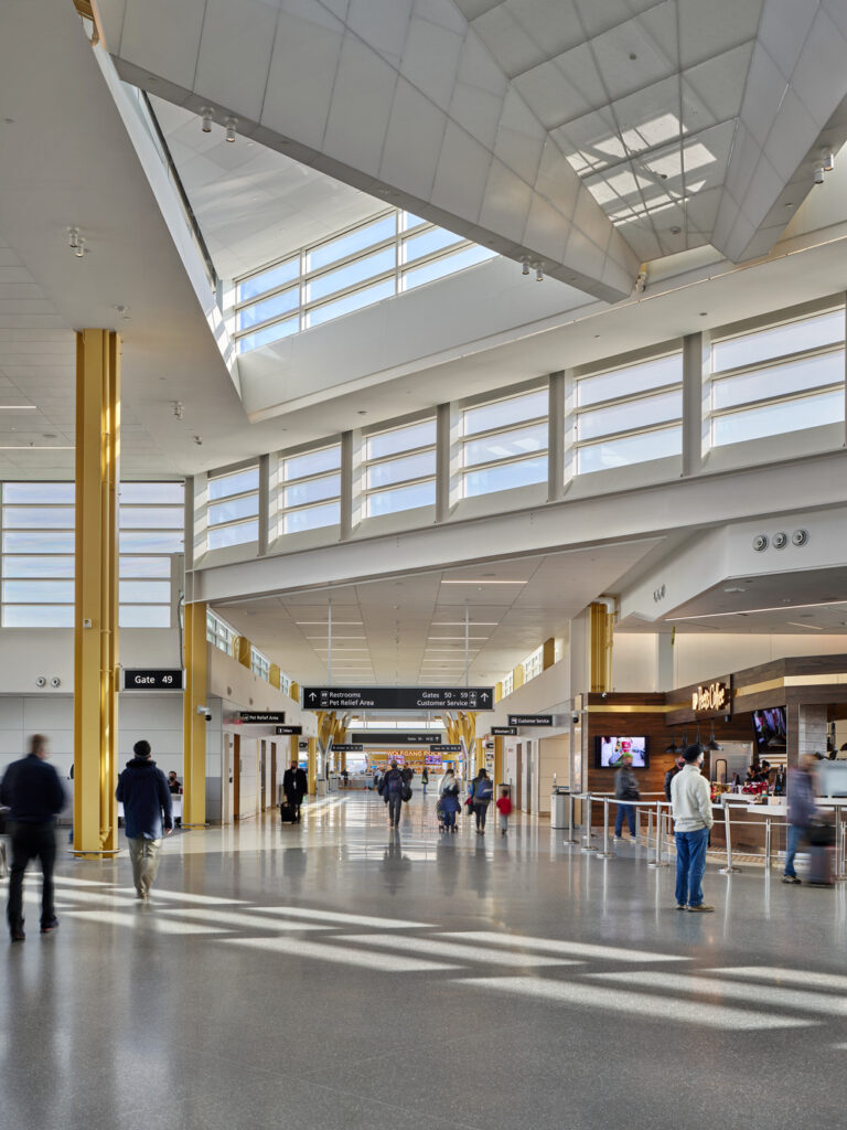 people walking through terminal
