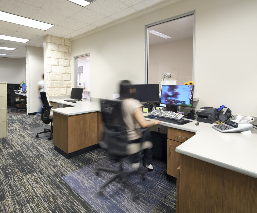 people working at service windows