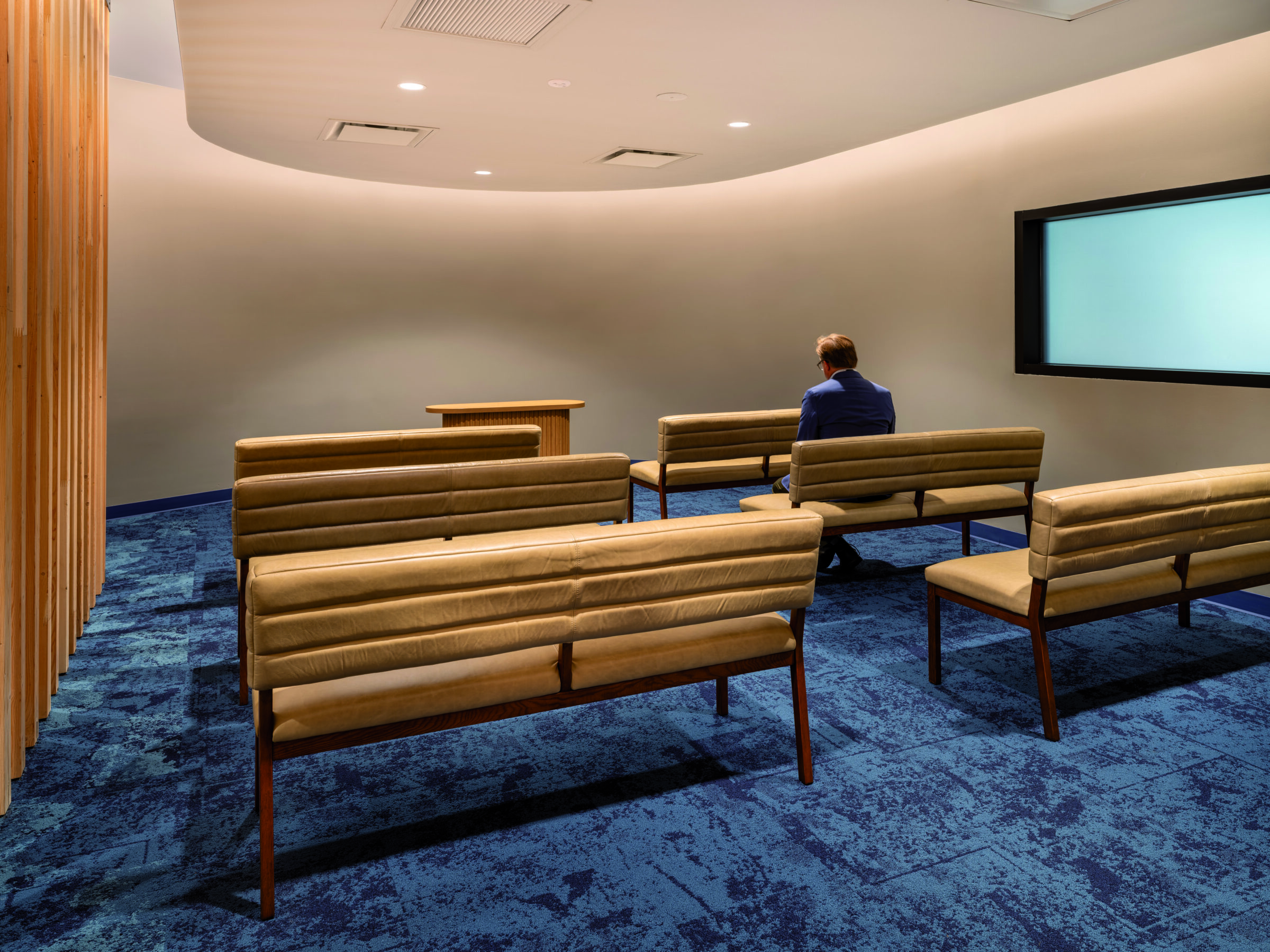 person sitting in interfaith room