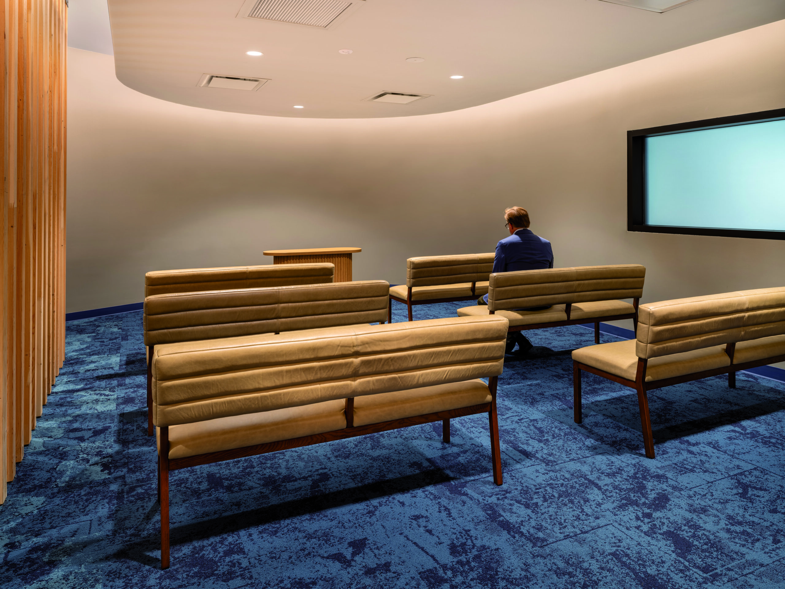 person sitting in interfaith room
