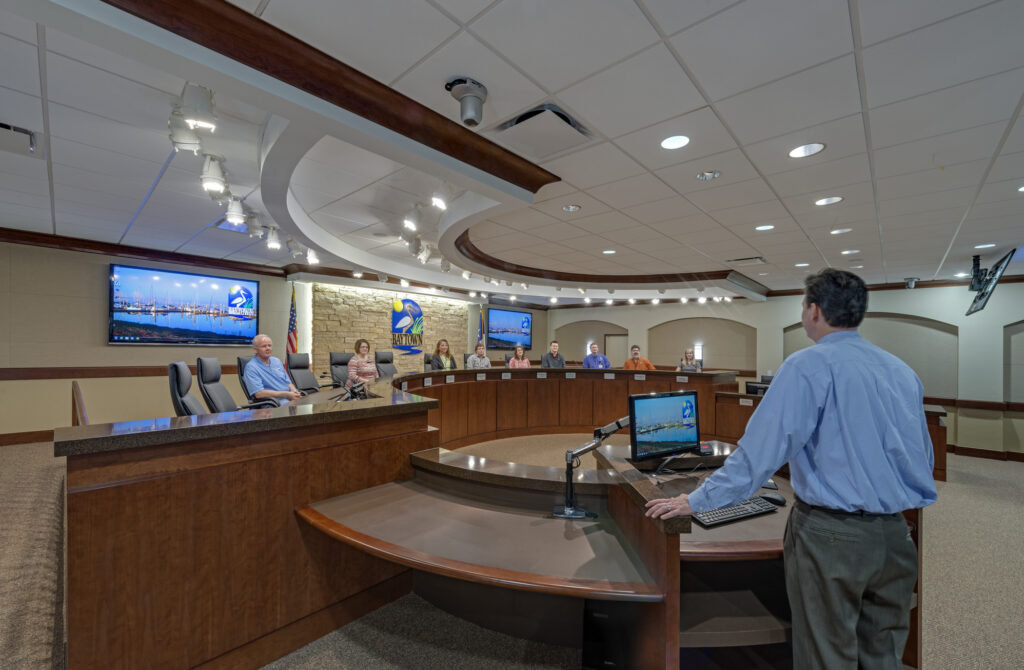 person speaking to city council in chambers