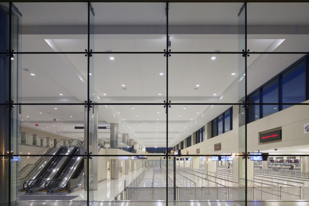 international arrivals hall interior through windows