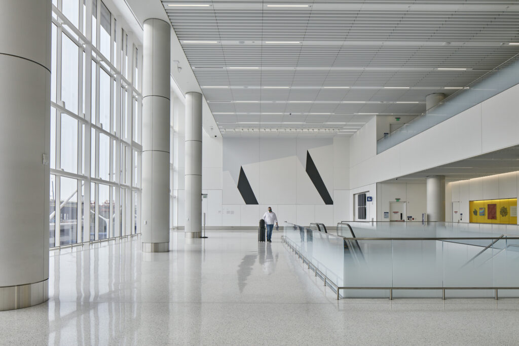 passenger walking by escalator