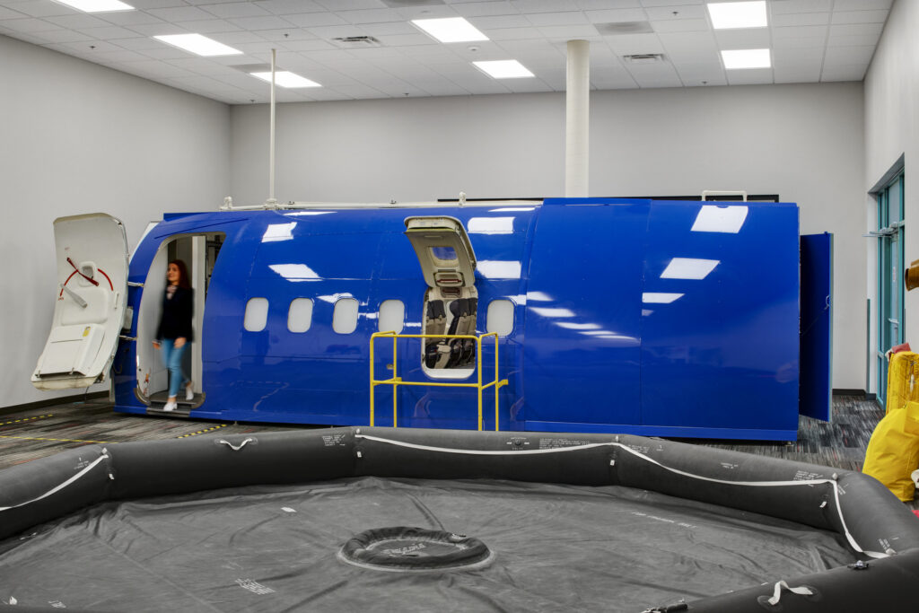 life raft and partial aircraft in training facility