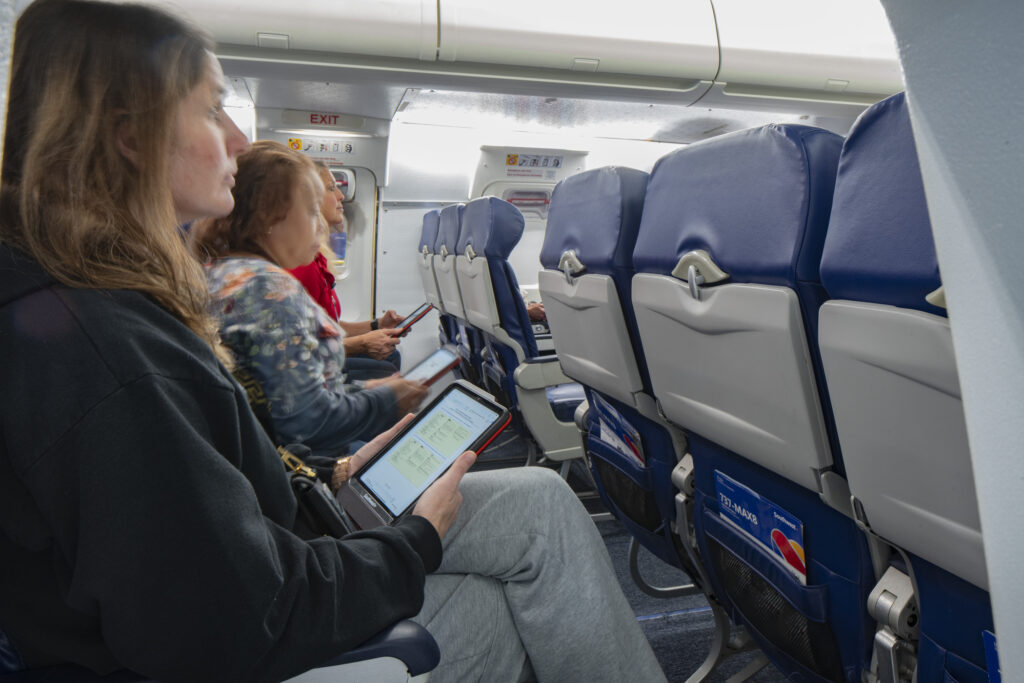 people sitting in training on aircraft