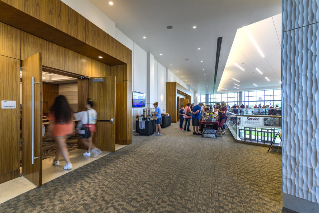 people gathering outside of multipurpose room