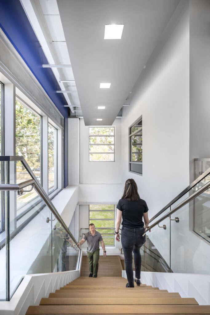women passing each other on the staircase