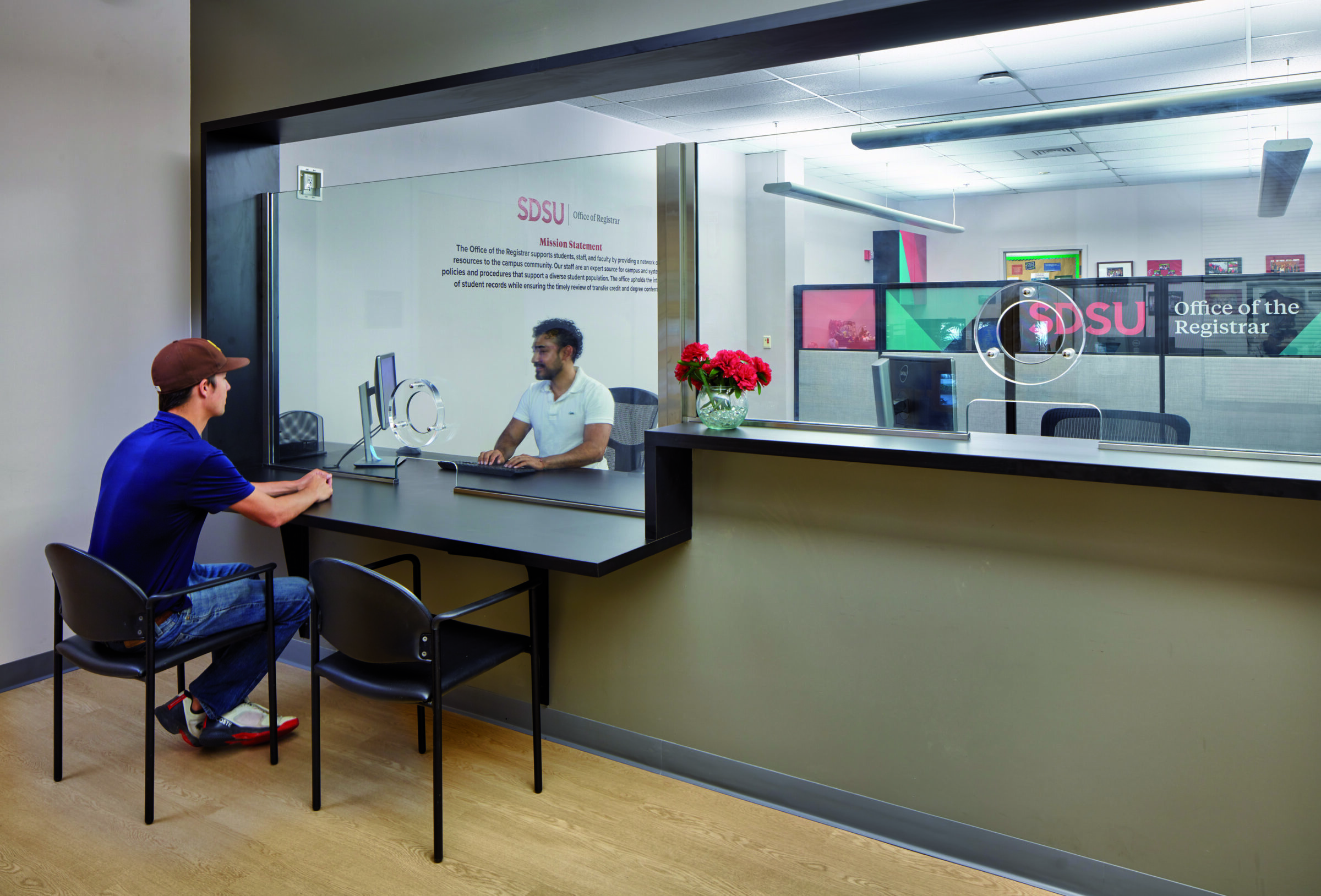 People talking at admissions office