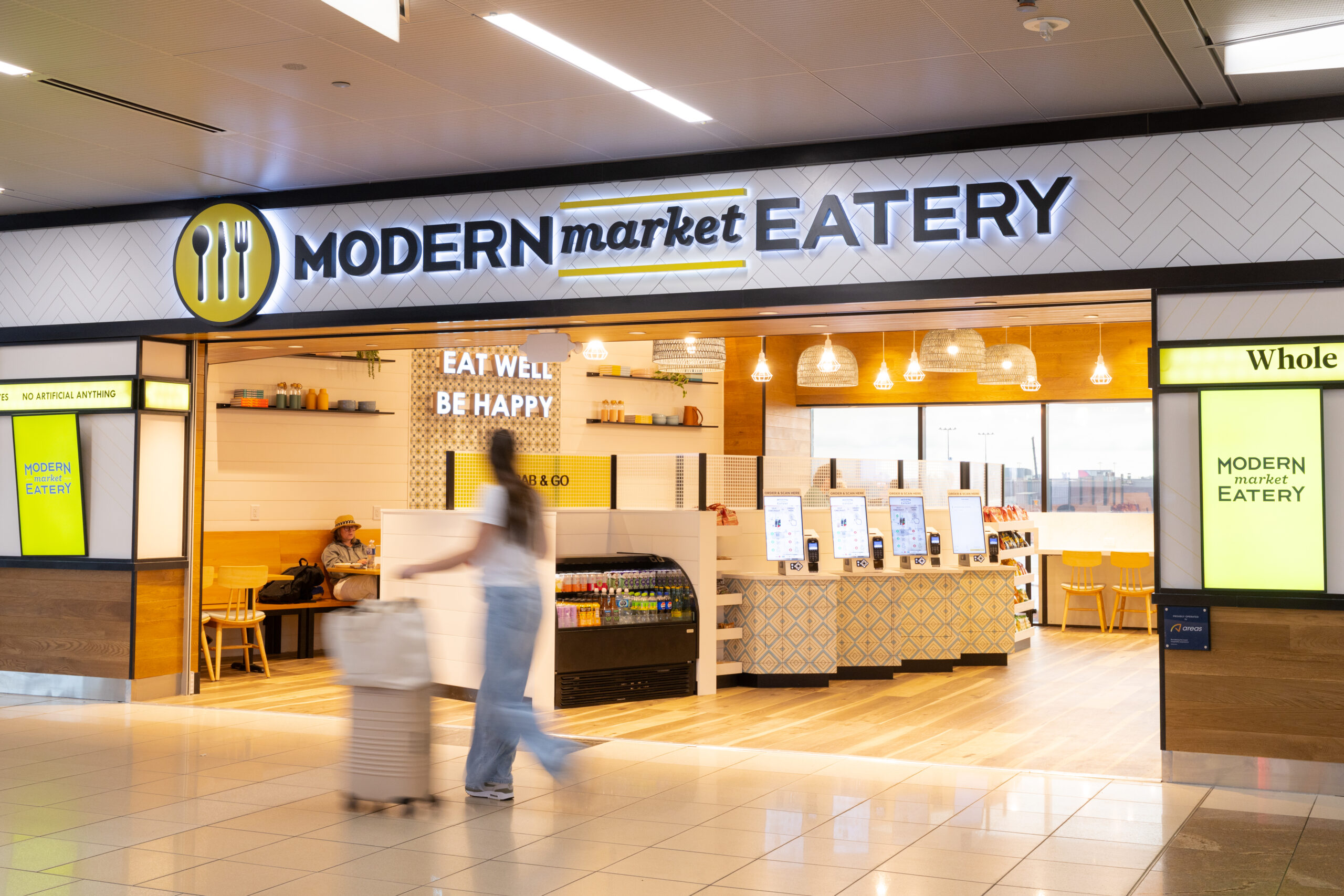 person walking outside modern market